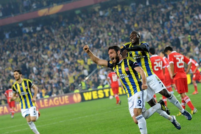 Fenerbahce players celebrate during the first leg