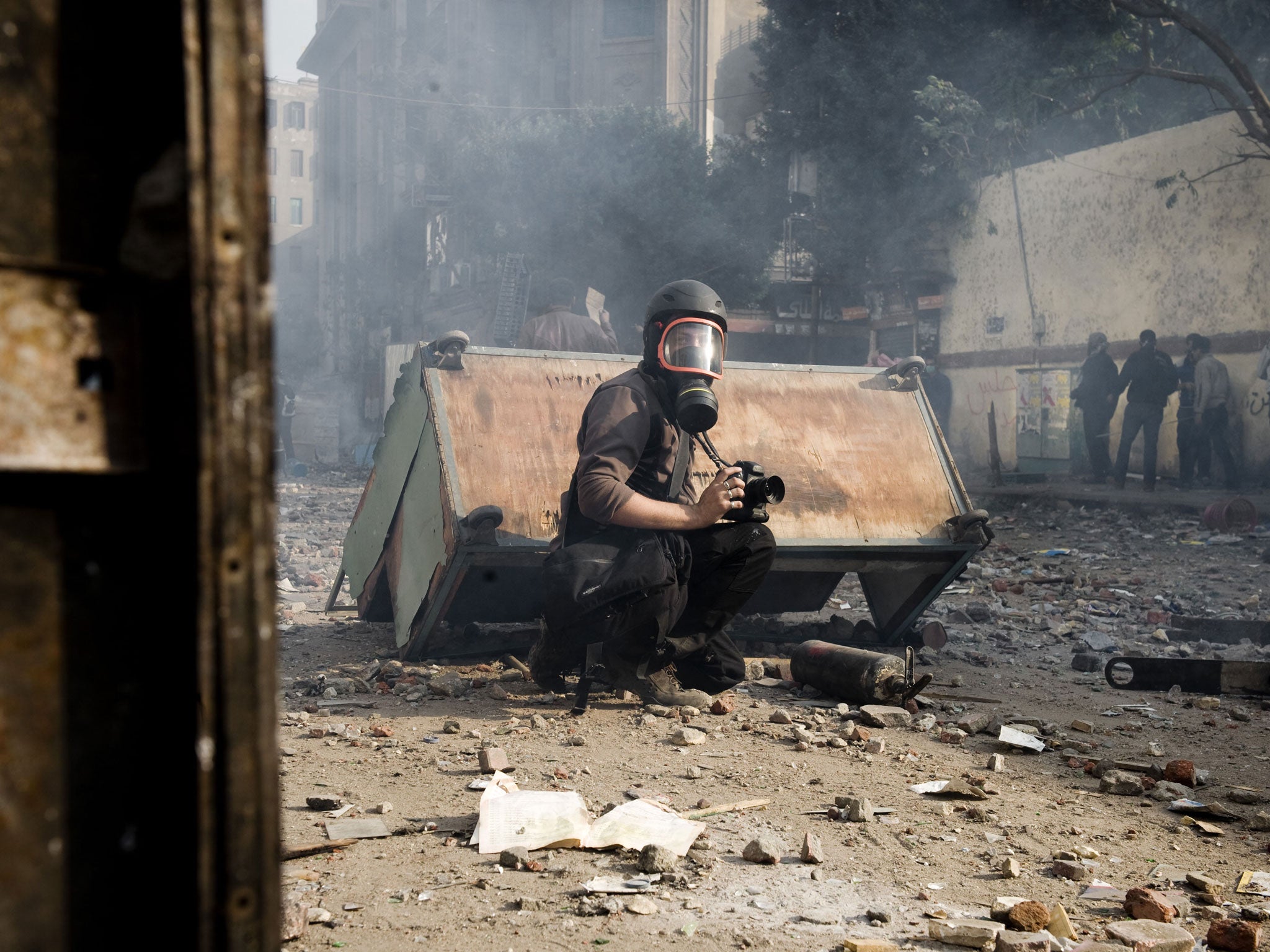 French photographer Remi Ochlik covering demonstrations in Cairo, who died last year in Homs, Syria