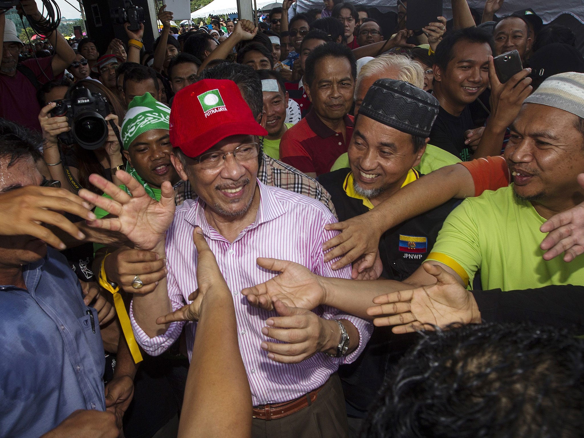 Opposition leader Anwar Ibrahim claims at least 40,000 people had been flown in for the election