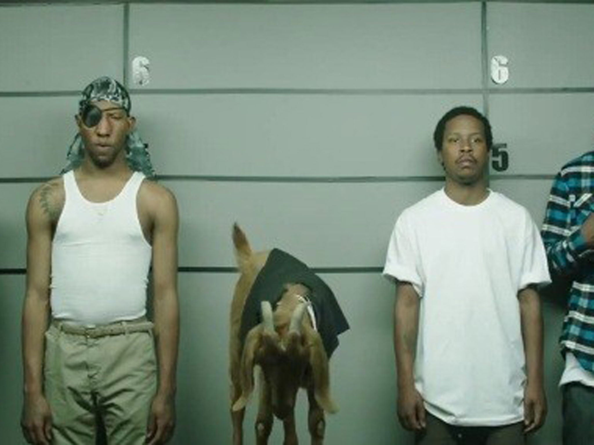 A still from the advert showing the line-up of suspects