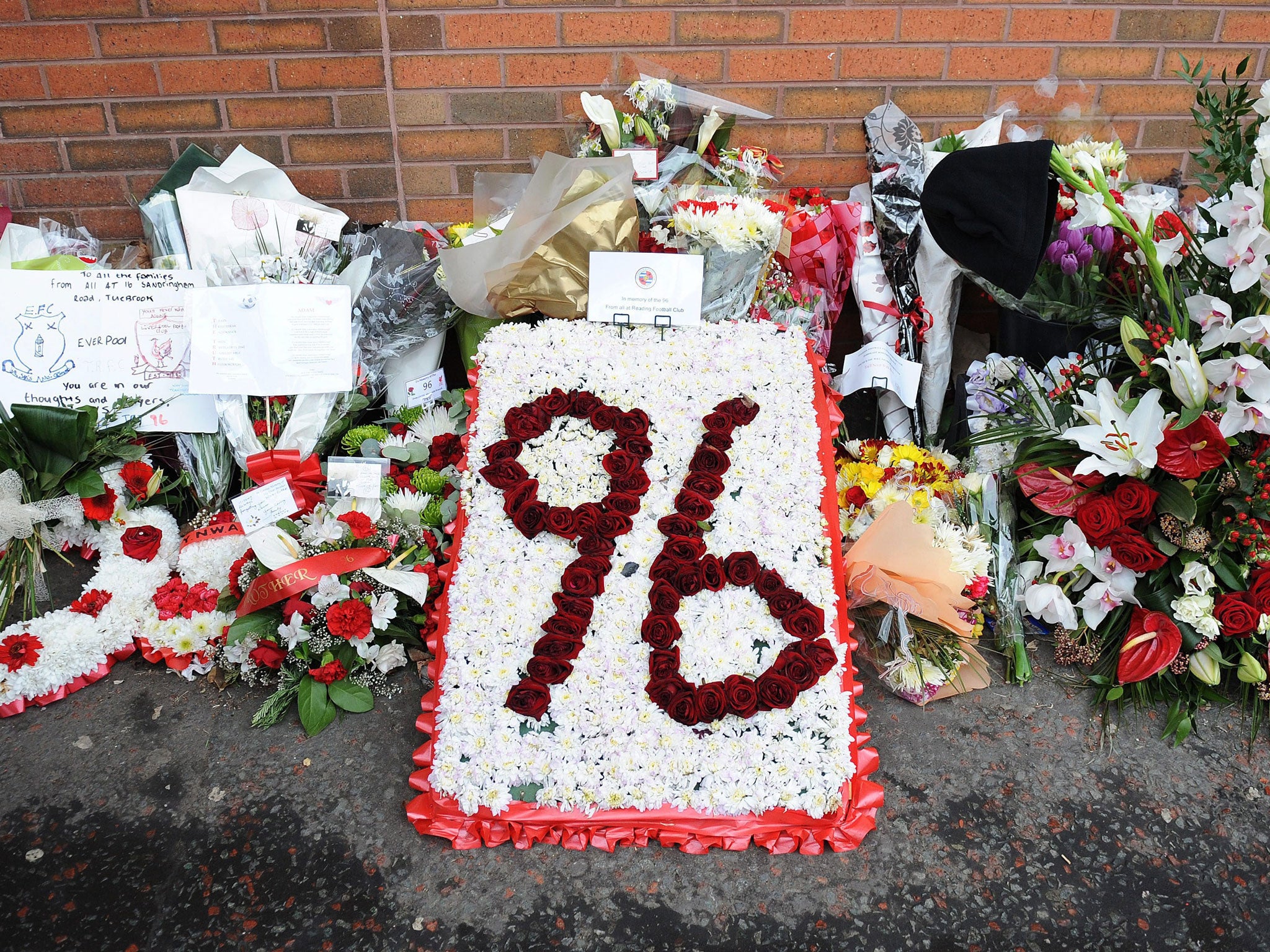 Flowers and a message left by Reading Football Club at the memorial outside Anfield for the 96 fans who died in the Hillsborough Stadium disaster