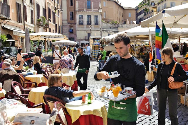Square meal: diners in the Campo de Fiori in Rome