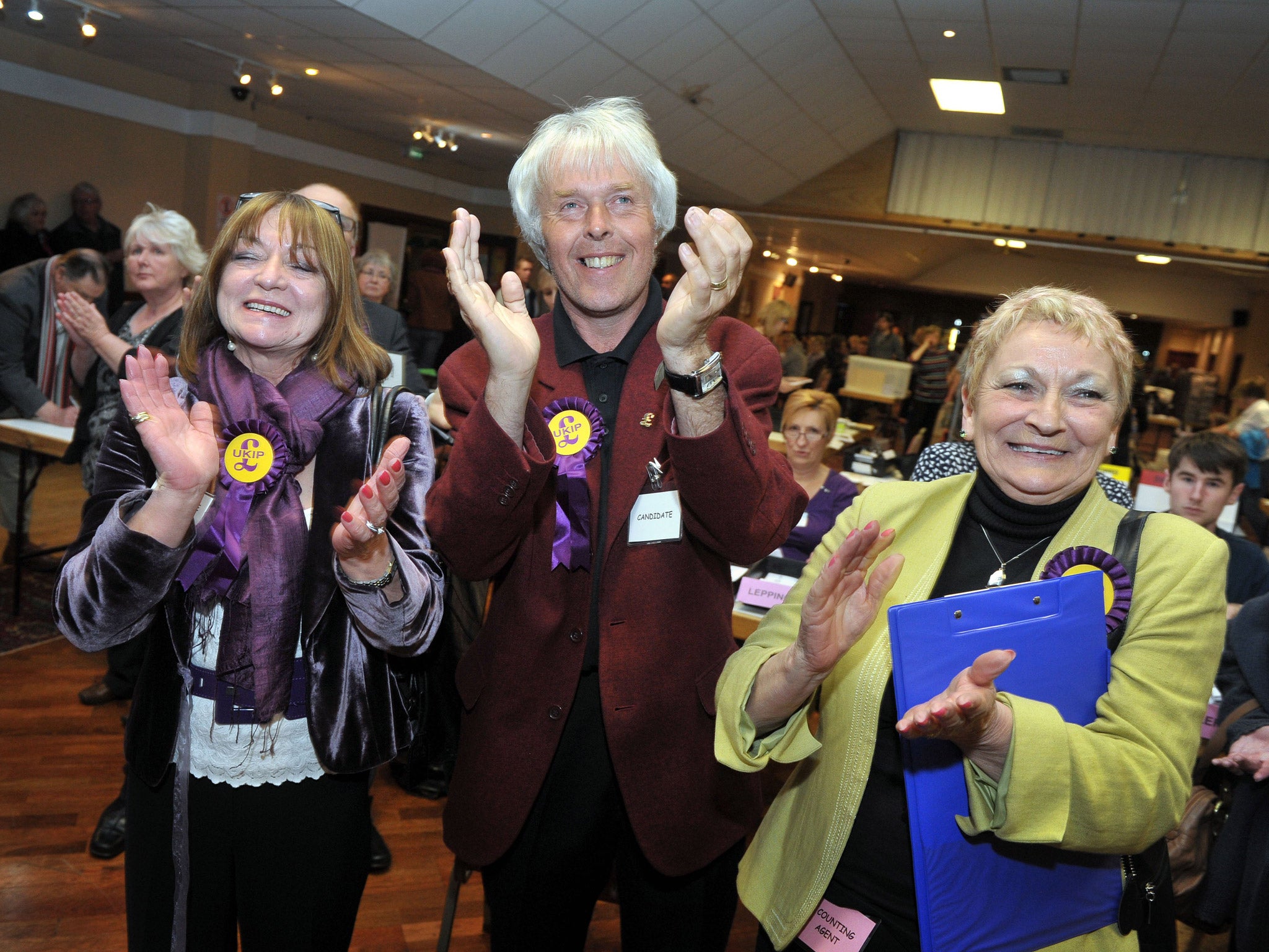 UKIP supporters celebrate as UKIP's Colin Guyton wins the Drybrook and Lydbrook seat, at the count in Oaklands Snooker Club in Cinderford, Gloucestershire