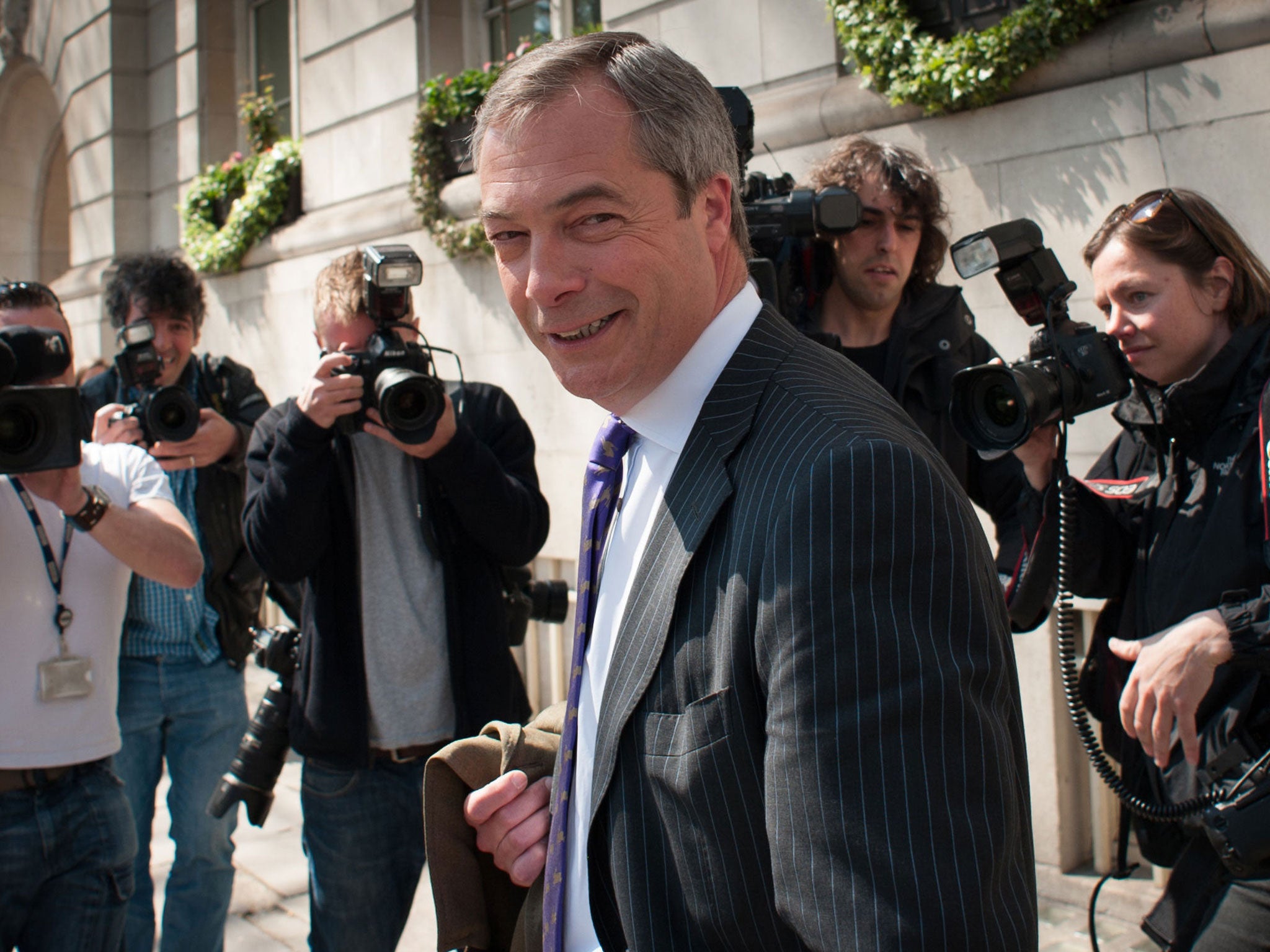 Nigel Farage makes his way to a pub to celebrate yesterday