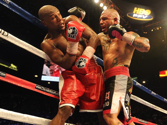 Floyd Mayweather is forced against the ropes in his last fight, against Miguel Cotto