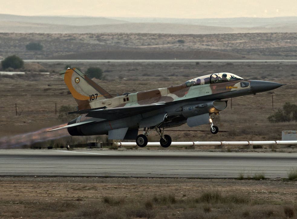 File image of an Israeli jet: Syria has accused Israel of carrying out air strikes near the capital Damascus