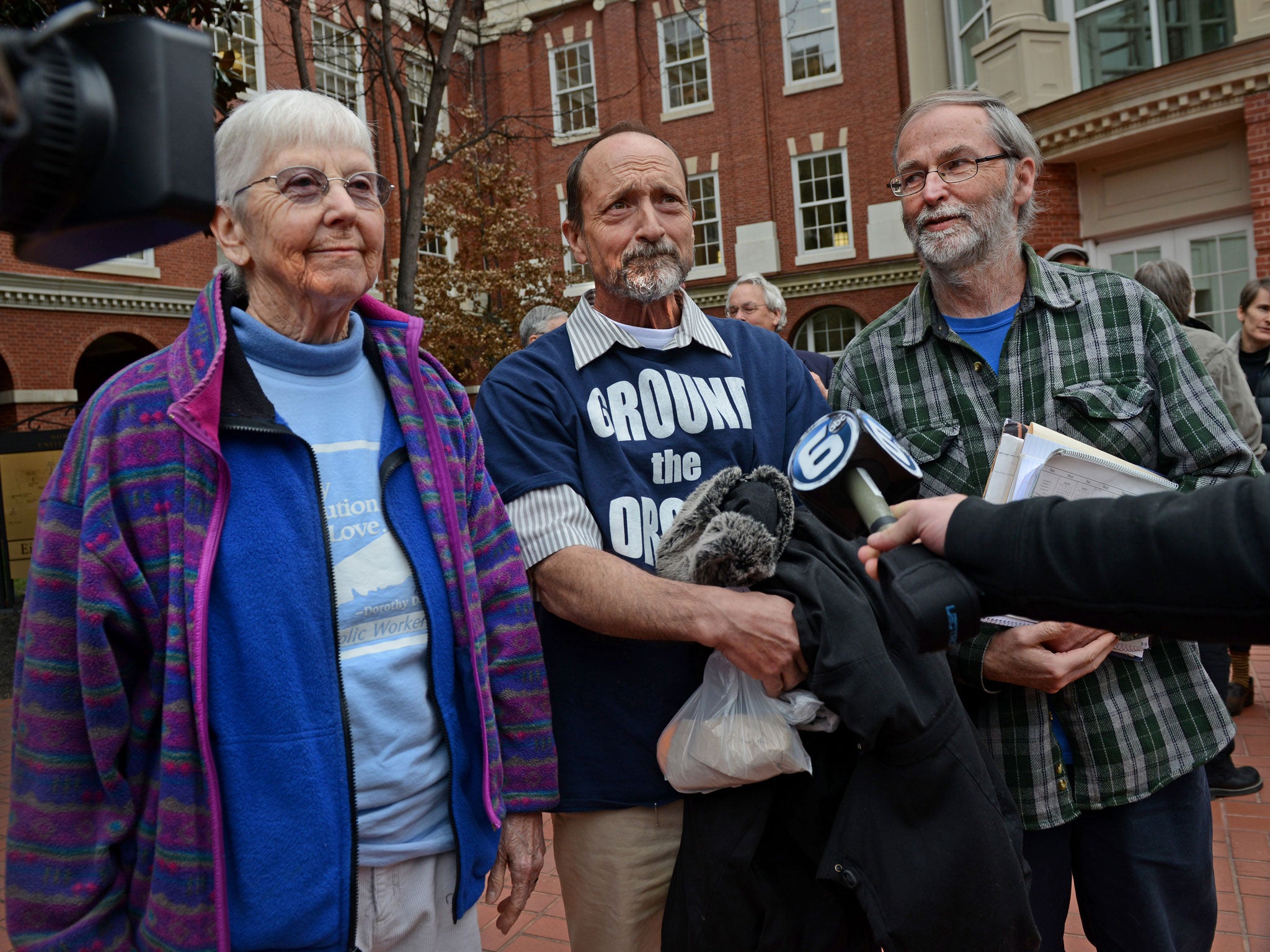 Sister Act: Sister Megan Rice, Michael Walli and Gregory Boertje-Obed are interviewed by local media after appearing in federal court in Knoxville