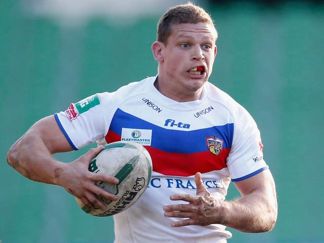 In the hunt: Wakefield’s Peter Fox scored two tries against the Dragons
