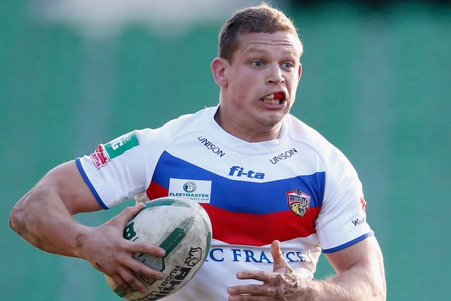 In the hunt: Wakefield’s Peter Fox scored two tries against the Dragons