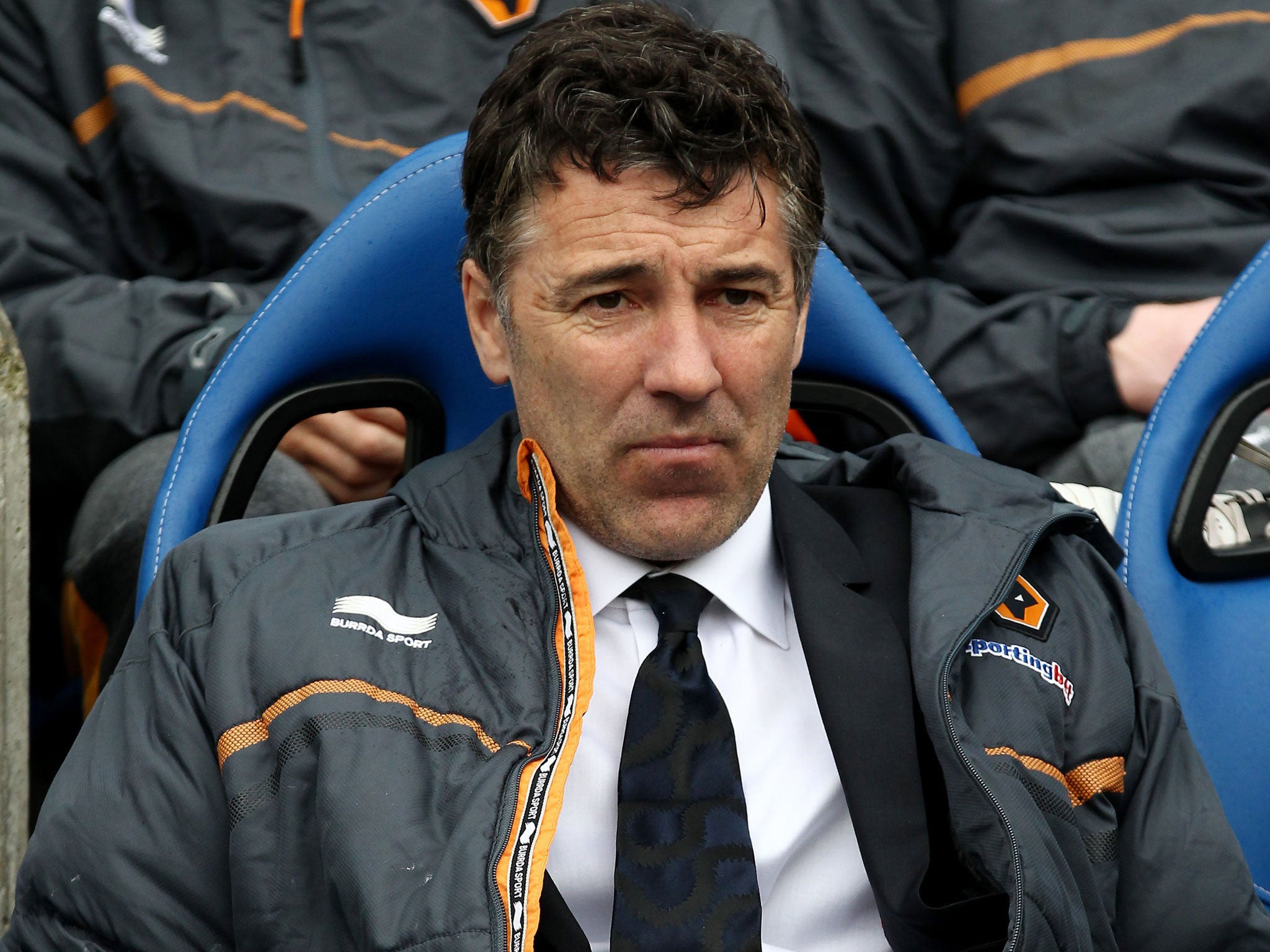 Feeling down: Dean Saunders absorbs the reality of relegation yesterday