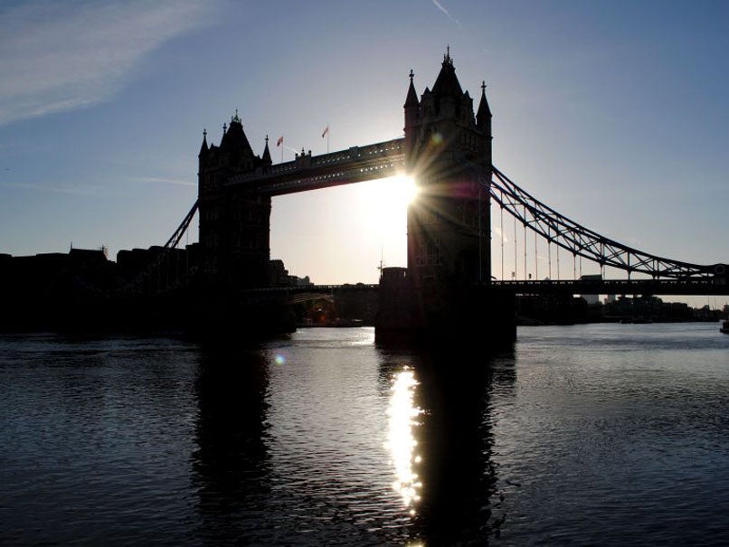 4 May 2013: The sun rises over Tower Bridge in London