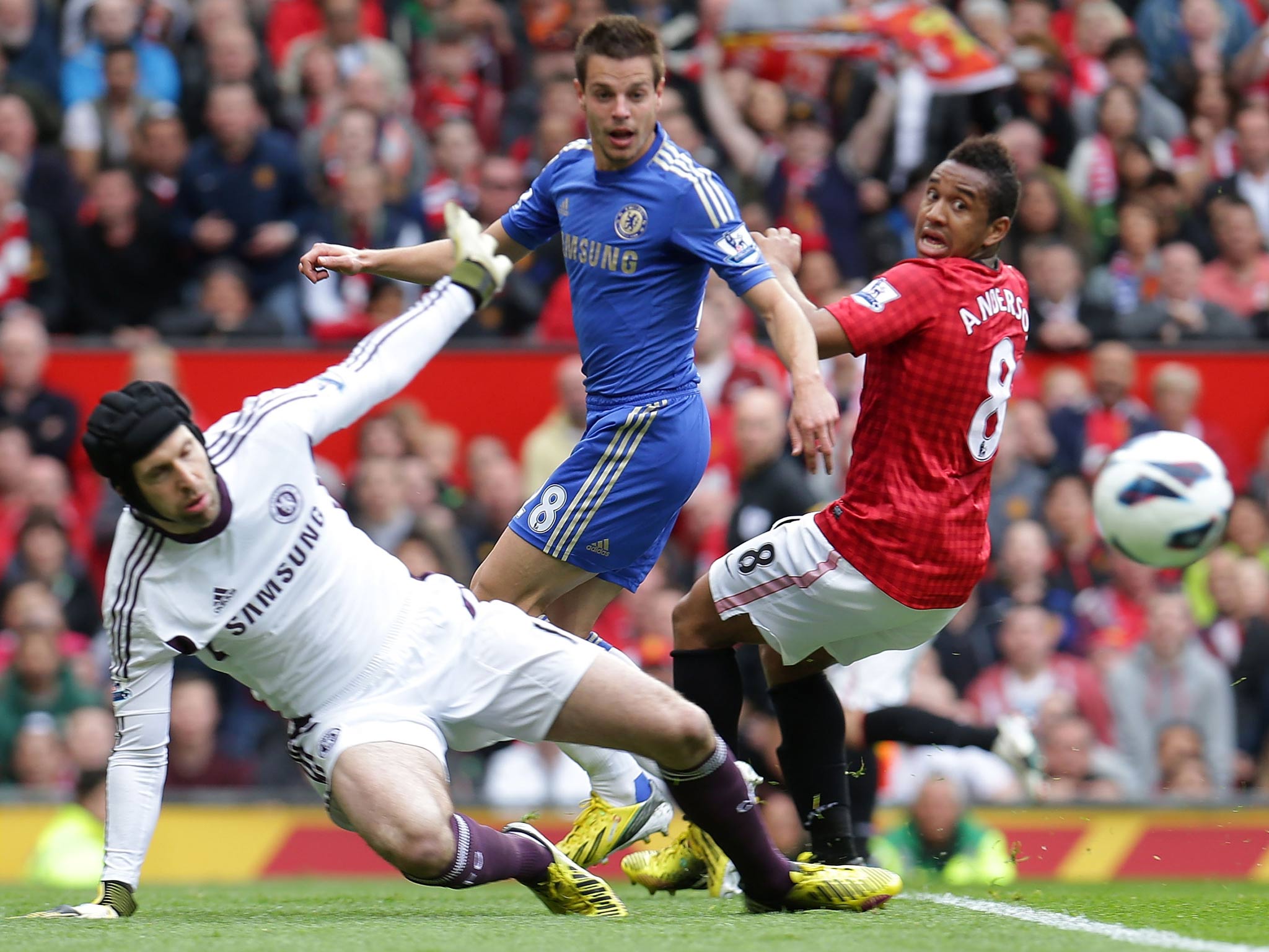 Petr Cech keeps out a Manchester United effort while Azpilicueta and Anderson look on
