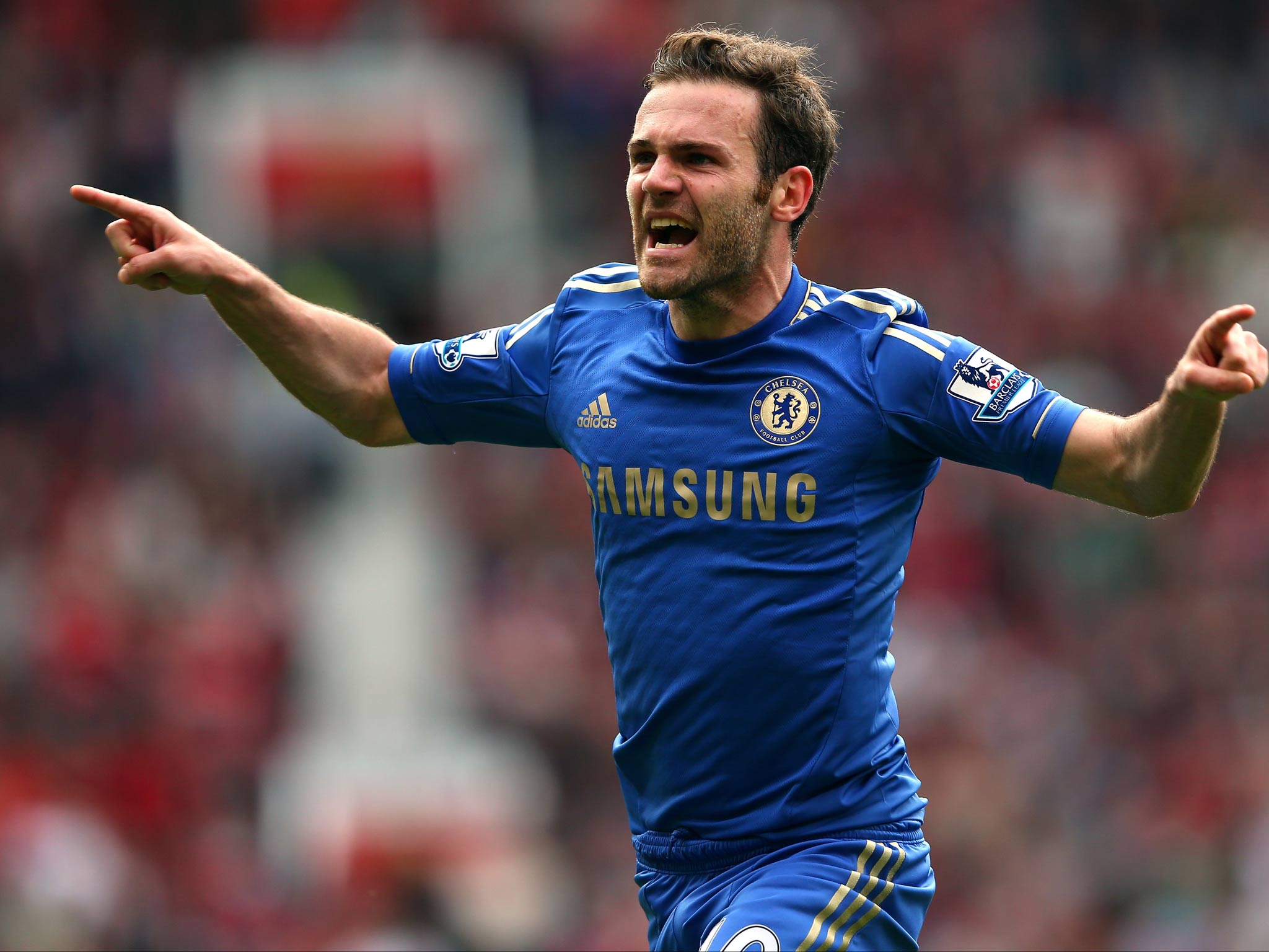 Juan Mata celebrates as his strike deflected off Phil Jones to give Chelsea a 1-0 win against Manchester United