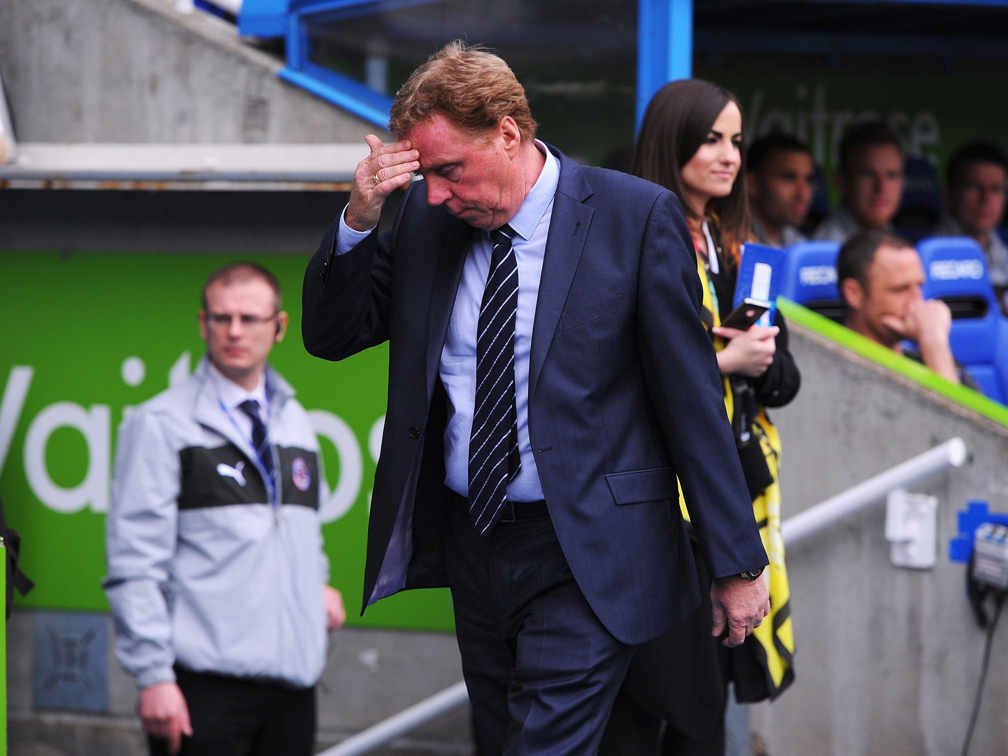 Harry Redknapp, manager of Queens Park Rangers wipes his brow prior to the Barclays Premier League match between Reading and Queens Park Rangers at the Madejski Stadium on April 28, 2013 in Reading, England.