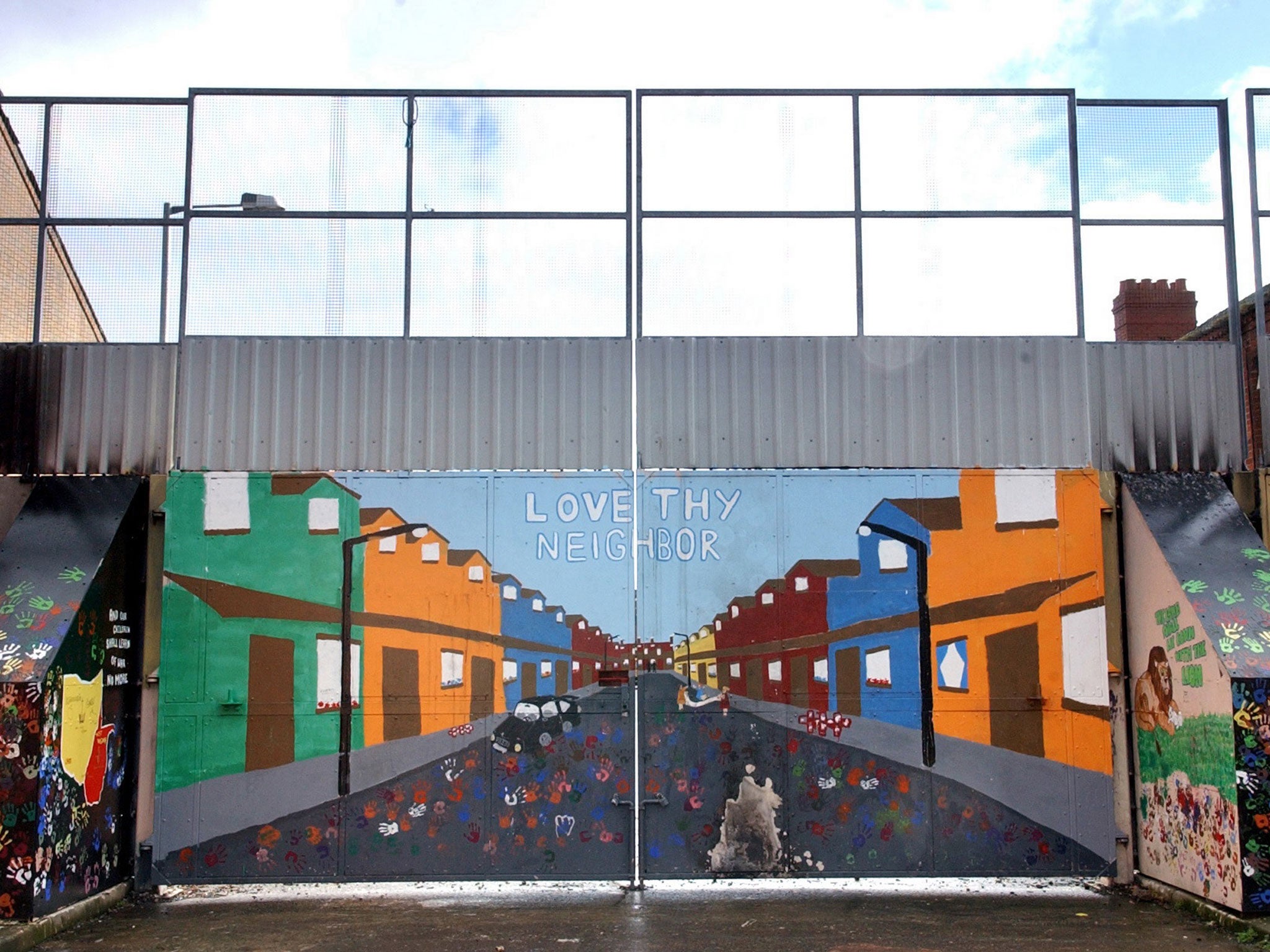 A brightly coloured security gate on the peace line in the nationalist Short Strand area of Belfast