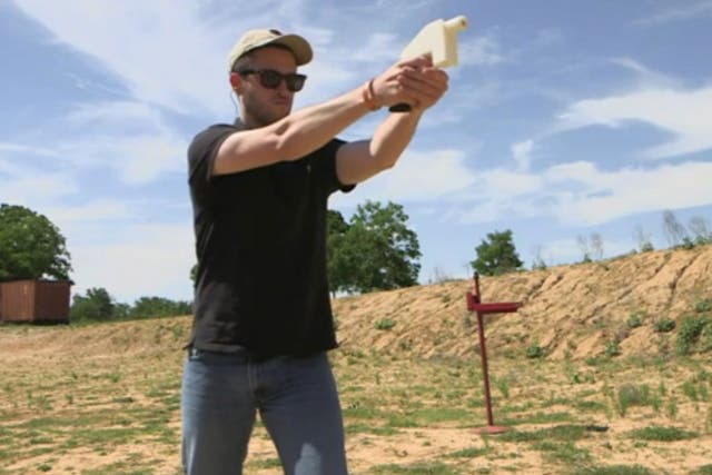 Cody Wilson test fires the Liberator, which is a 3D printer handgun