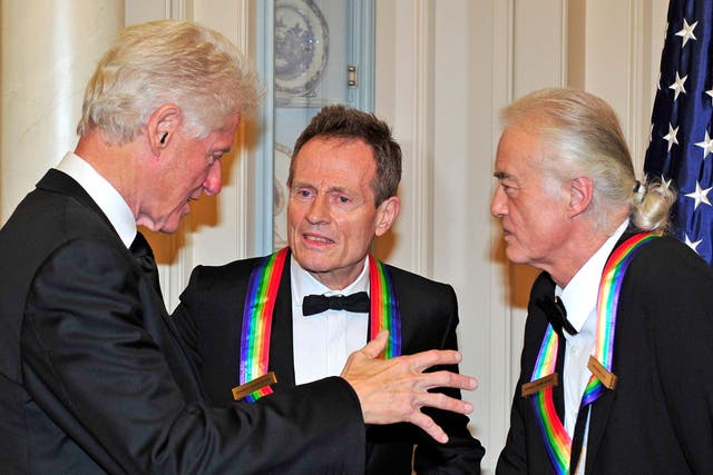 Bill Clinton with John Paul Jones and Jimmy Page as the band were made Kennedy honorees