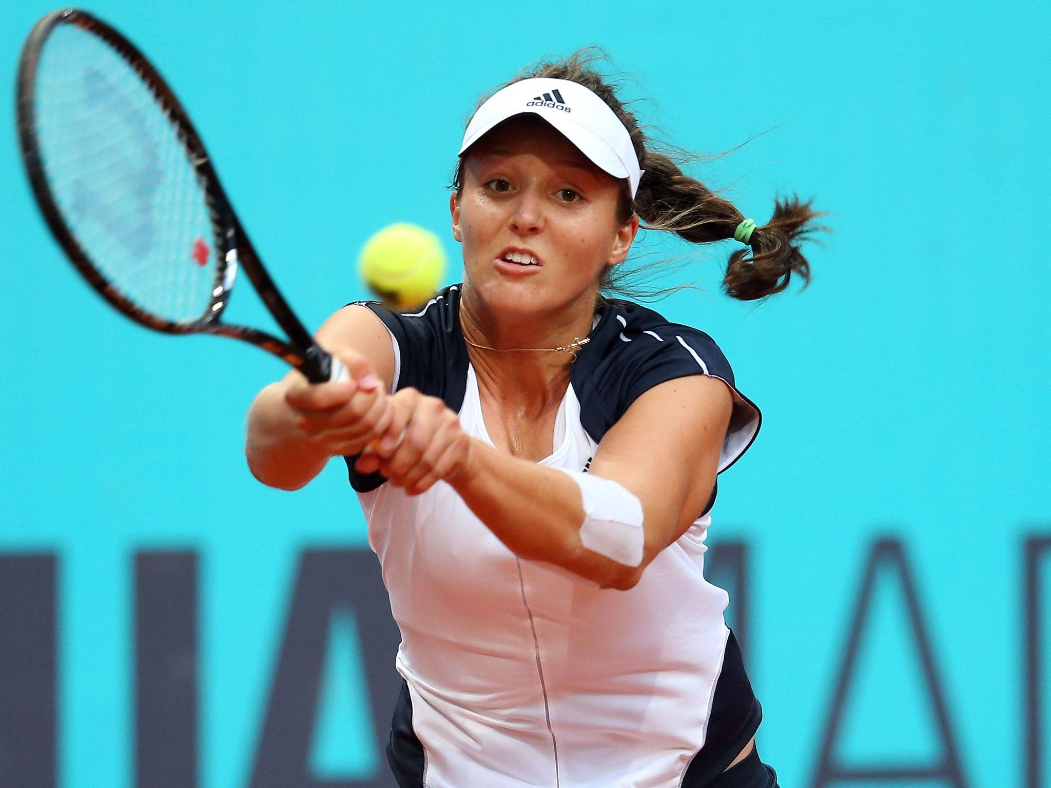 Laura Robson of Great Britain plays a backhand in her match against Magdalena Rybarikova of Slovakia during the Mutua Madrid Open tennis tournament at the Caja Magica