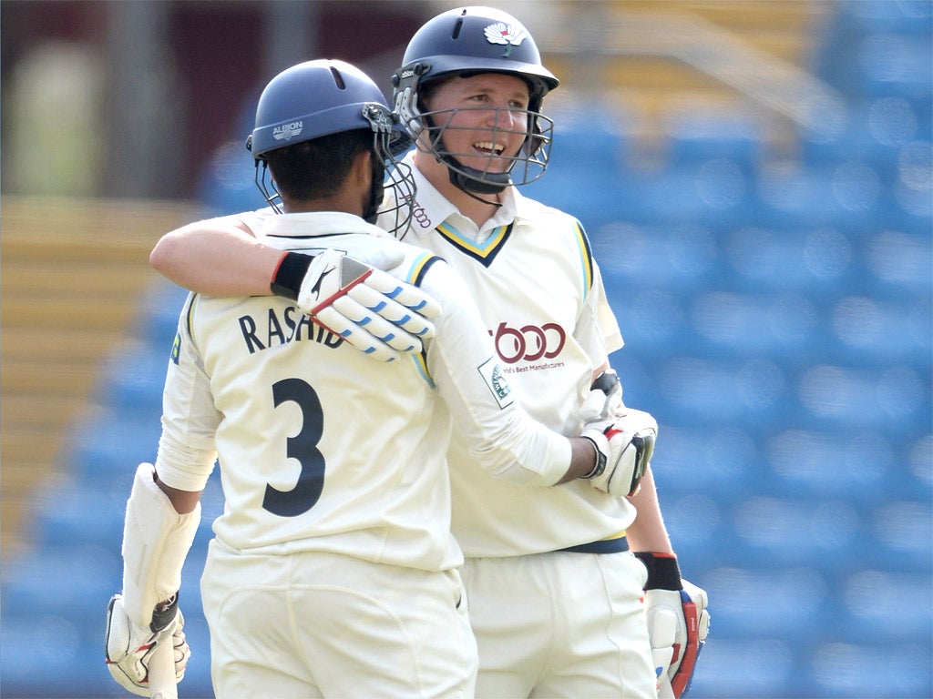 Yorkshire's Gary Ballance celebrates with Adil Rashid after reaching his century