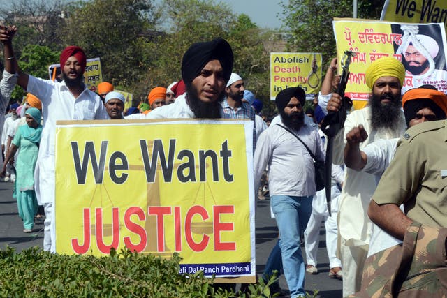 Indian Sikhs shout slogans during a protest march to the Presidential palace in New Delhi on April 19, 2013, against the Supreme Court rejection of a petition by Devinderpal Singh Bhullar to change his death sentence to life imprisonment. Bhullar was given the death sentance, on August 25, 2001, for the September 10, 1993 blast at the Indian Youth Congress (IYC) office in New Delhi that left nine people dead and many injured.