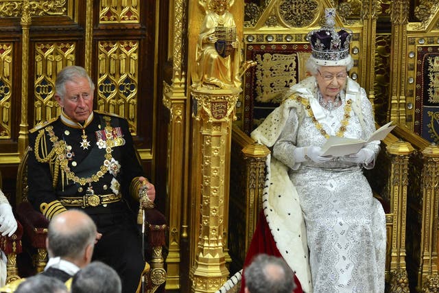 Britain's Queen Elizabeth delivers her speech during the State Opening of Parliament at the House of Lords, alongside Prince Charles