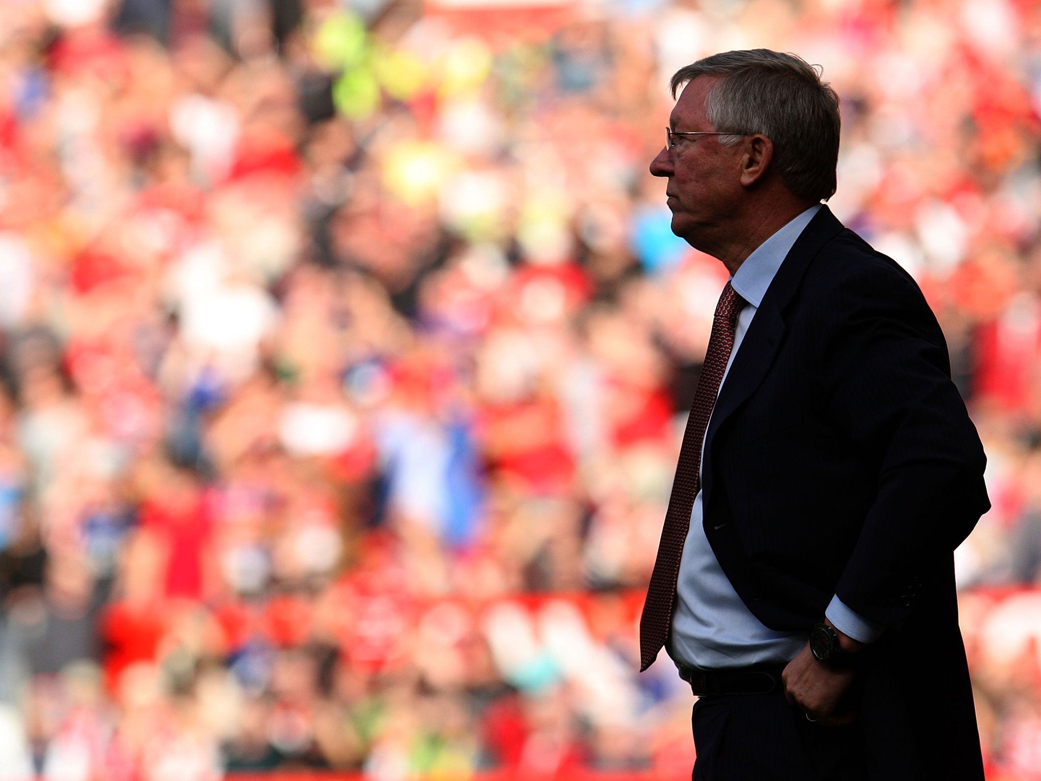 Sir Alex Ferguson of Manchester United watches from the touchline during the Barclays Premier League match between Manchester United and Chelsea at Old Trafford on September 18, 2011 in Manchester, England.