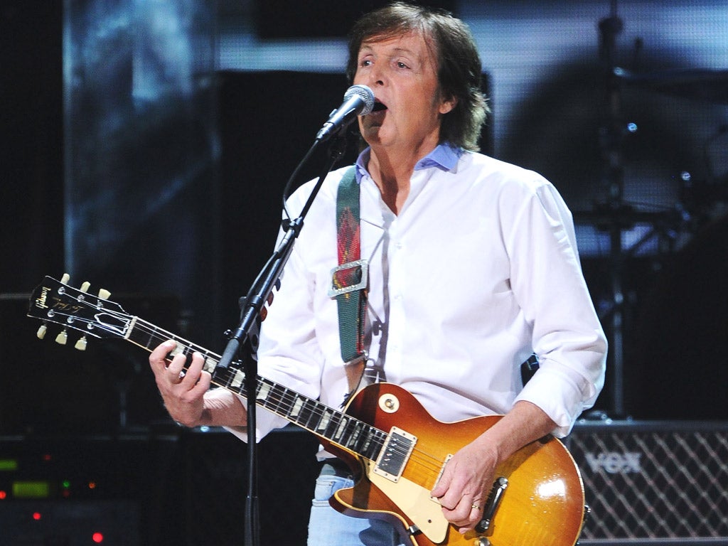 Sir Paul McCartney performing on stage