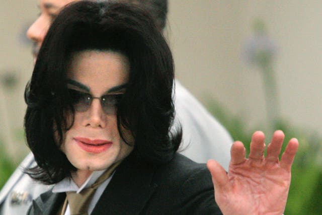 Singer Michael Jackson pictured outside the Santa Barbara County Courthouse for proceedings in his child molestation trial in 2005 in Santa Maria, California. Wade Robson, who testified in his defence at the trial, has now accused the singer of sexual abu