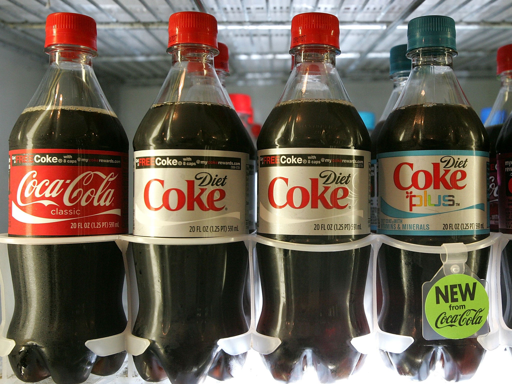 Bottles of Coca Cola are seen on a shelf at the Mayflower Market July 17, 2007 in San Francisco, California.