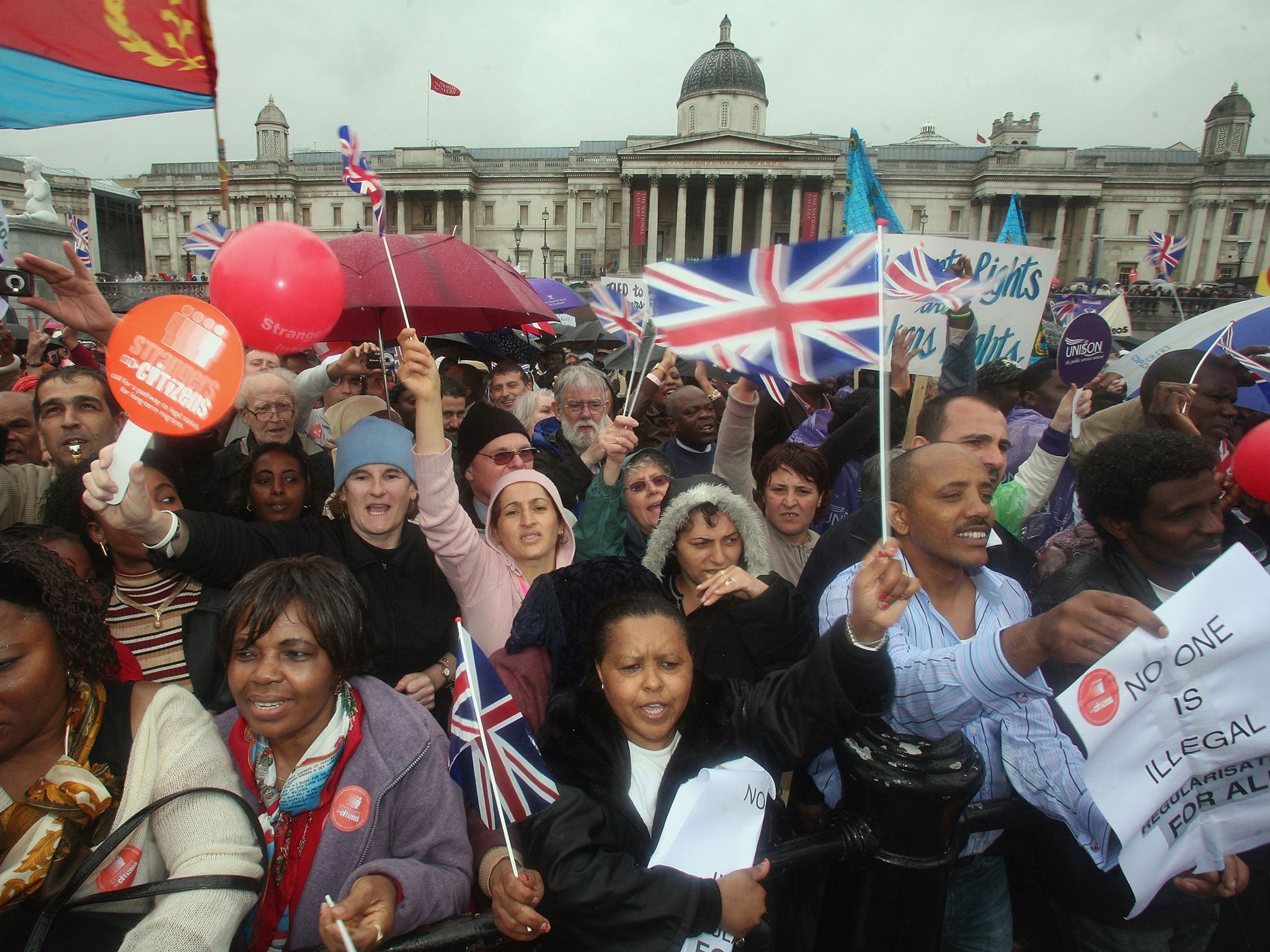 Protestors cheer, wave flags and banners during a march hoping to draw attention to claims of exploitation and discrimination of migrant workers, in Trafalgar Square on May 7, 2007 in London.