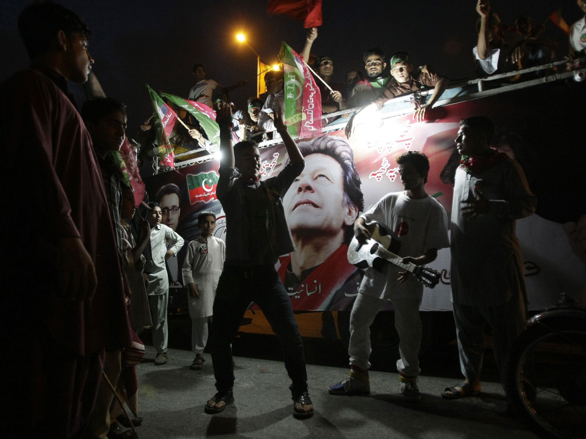 Supporters of Imran Khan at a rally in Karachi yesterday