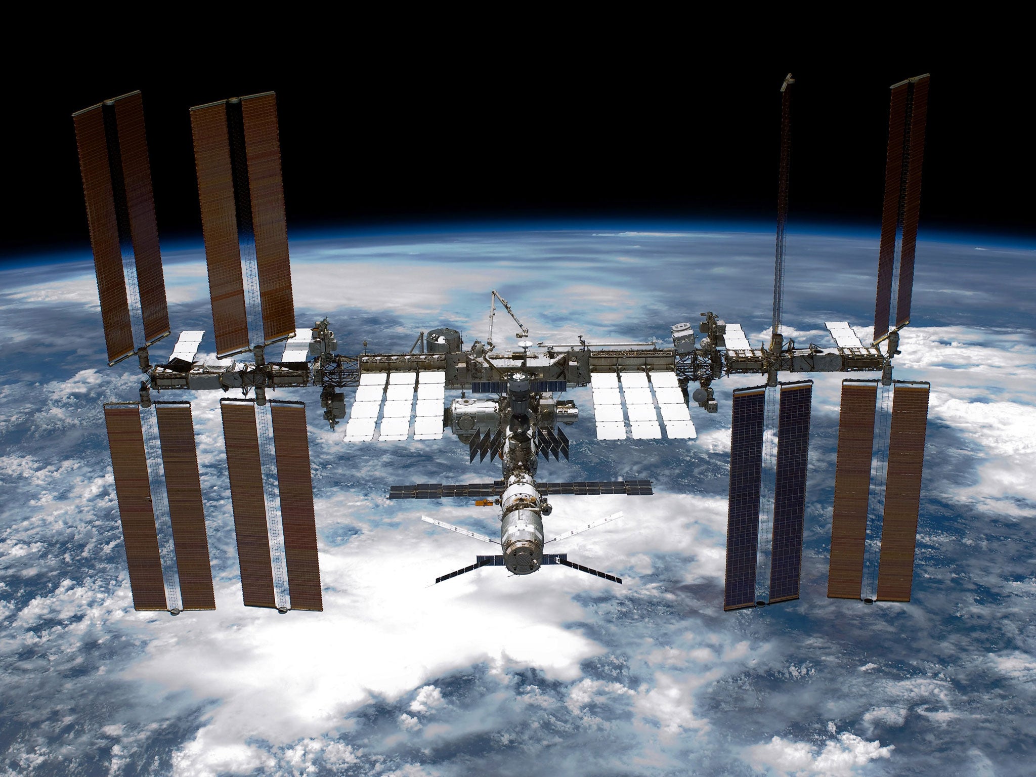 The six-member crew of the space station, which is in orbit 370 km above the earth, reported seeing small white flakes floating away from an area outside the craft yesterday