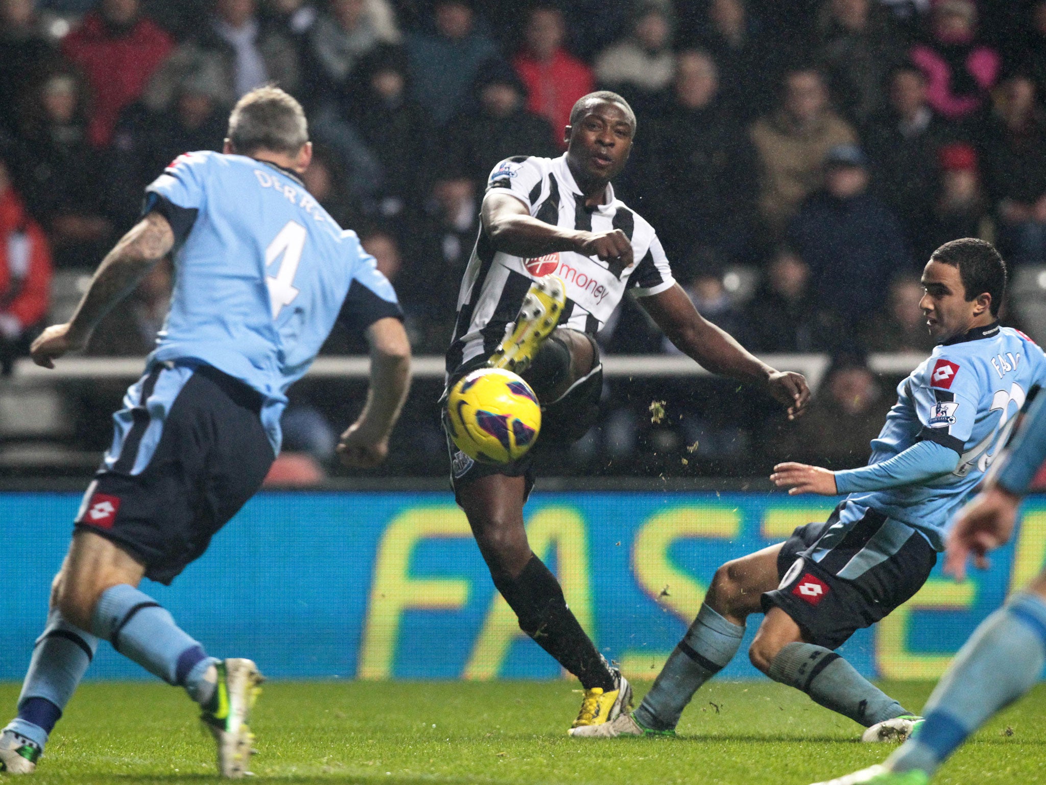 Newcastle's Nigerian striker Shola Ameobi (2nd L) scores the winning goal