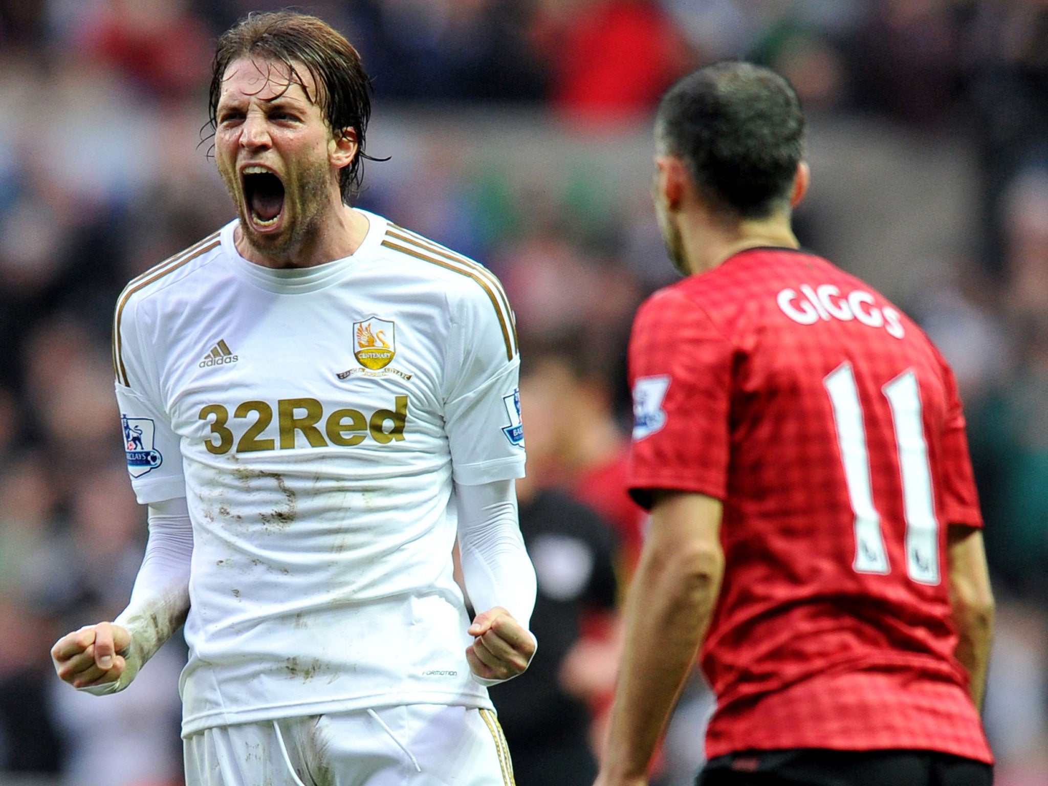 Swansea's Spanish player Michu (L) reacts after the final whistle during the English Premier League football match between Swansea City and Manchester United
