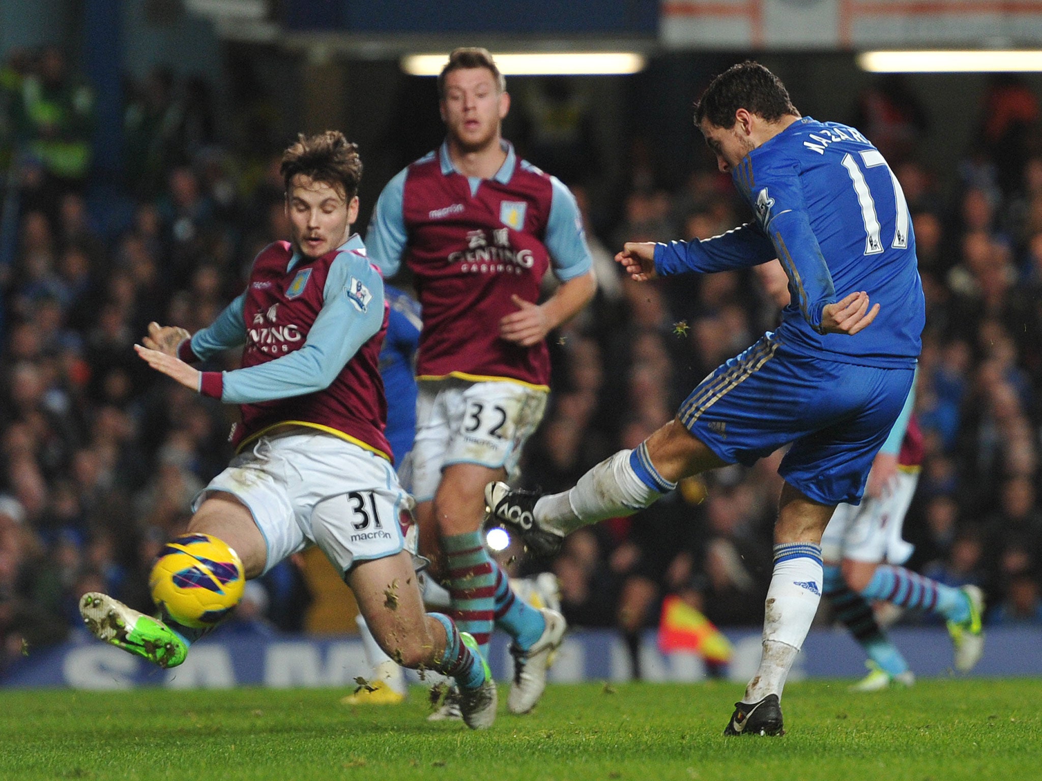 Chelsea's Belgian midfielder Eden Hazard (R) scores their seventh goal past Aston Villa's Australian midfielder Chris Herd