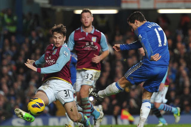 Chelsea's Belgian midfielder Eden Hazard (R) scores their seventh goal past Aston Villa's Australian midfielder Chris Herd