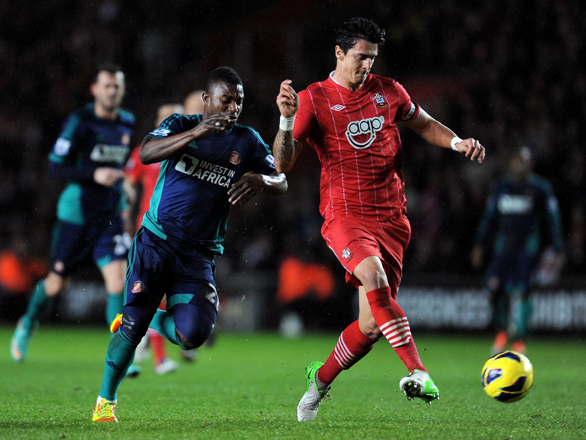 Jose Fonte of Southampton hold soff the challenge from Stephane Sessegnon of Sunderland