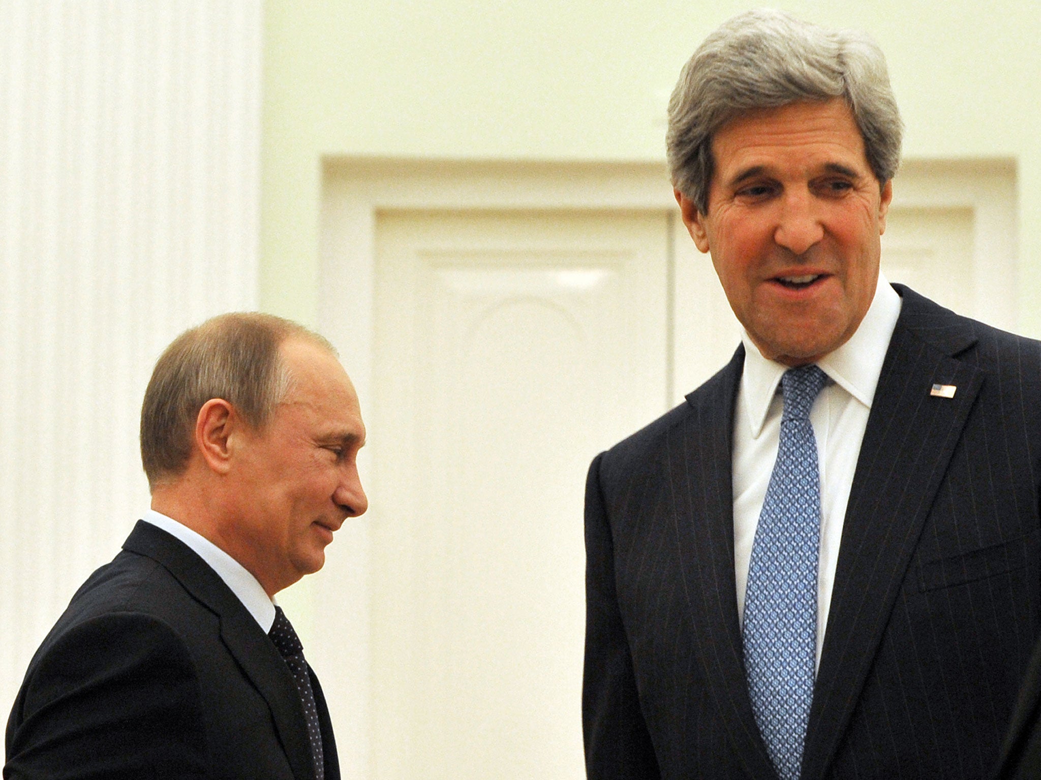 Russian President Vladimir Putin (L) and the US Secretary of State John Kerry take their seats prior their talks in Kremlin in Moscow on May 7, 2013. Kerry sought today to narrow differences over the conflict in Syria with Putin, urging the Russian strongman to find common ground to help end the bloodshed.