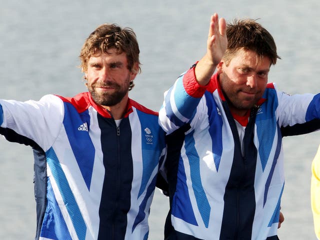 Simpson, right, and Iain Percy step up to the Olympic podium at Weymouth last year  