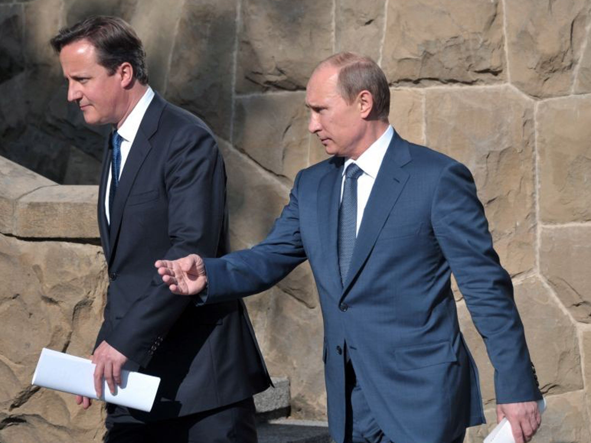 Russian President Vladimir Putin (right) and Britain's Prime Minister David Cameron arrive to address the media after their meeting in Sochi