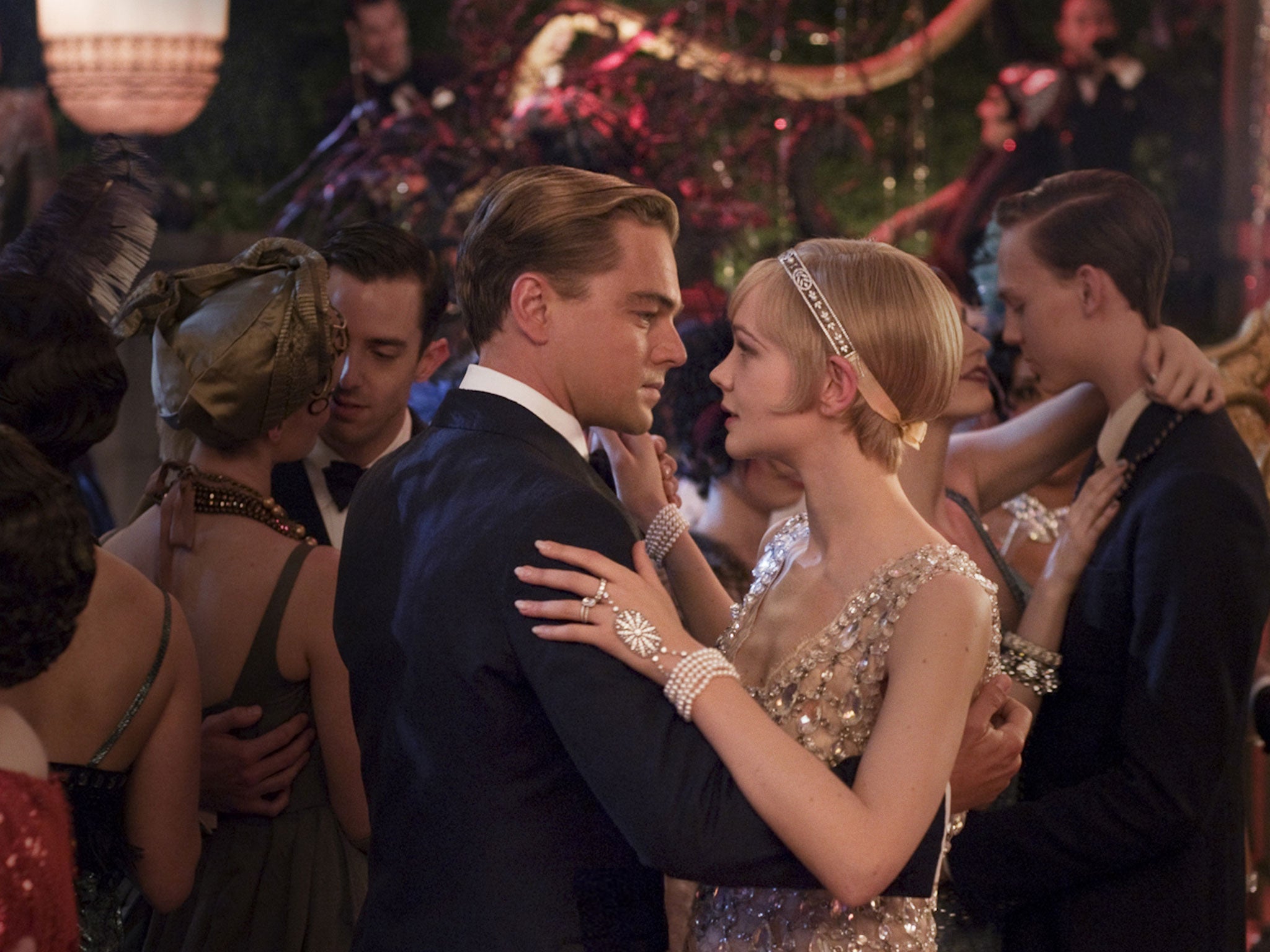 Leonardo DiCaprio as Jay Gatsby, and Carey Mulligan as Daisy Buchanan