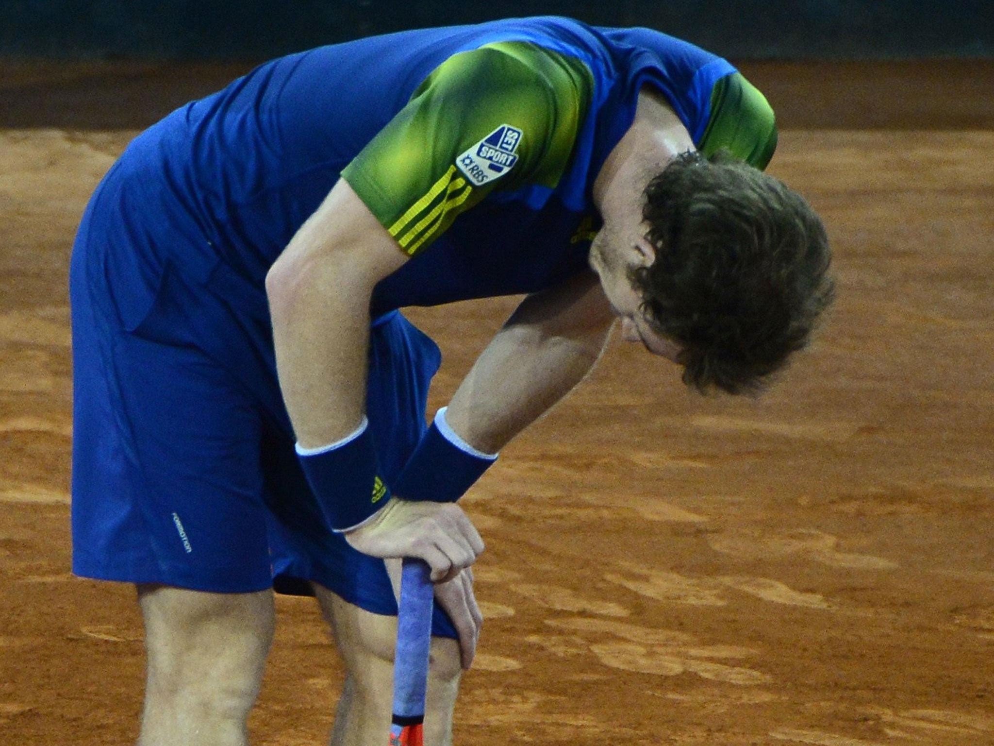 Andy Murray looks defeated during his tennis match against Czech player Tomas Berdych at the Madrid Masters