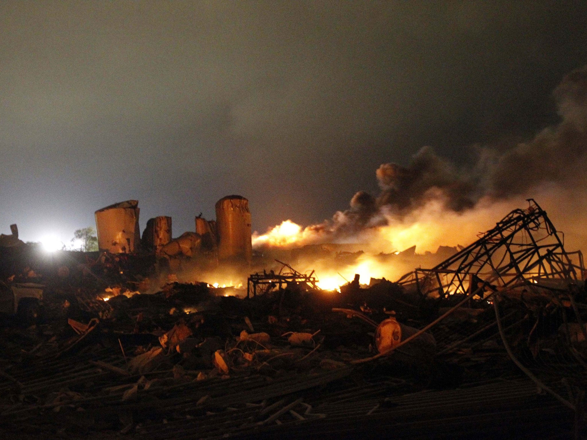 The remains of the fertilizer plant burn after the explosion at the plant in the town of West in Texas