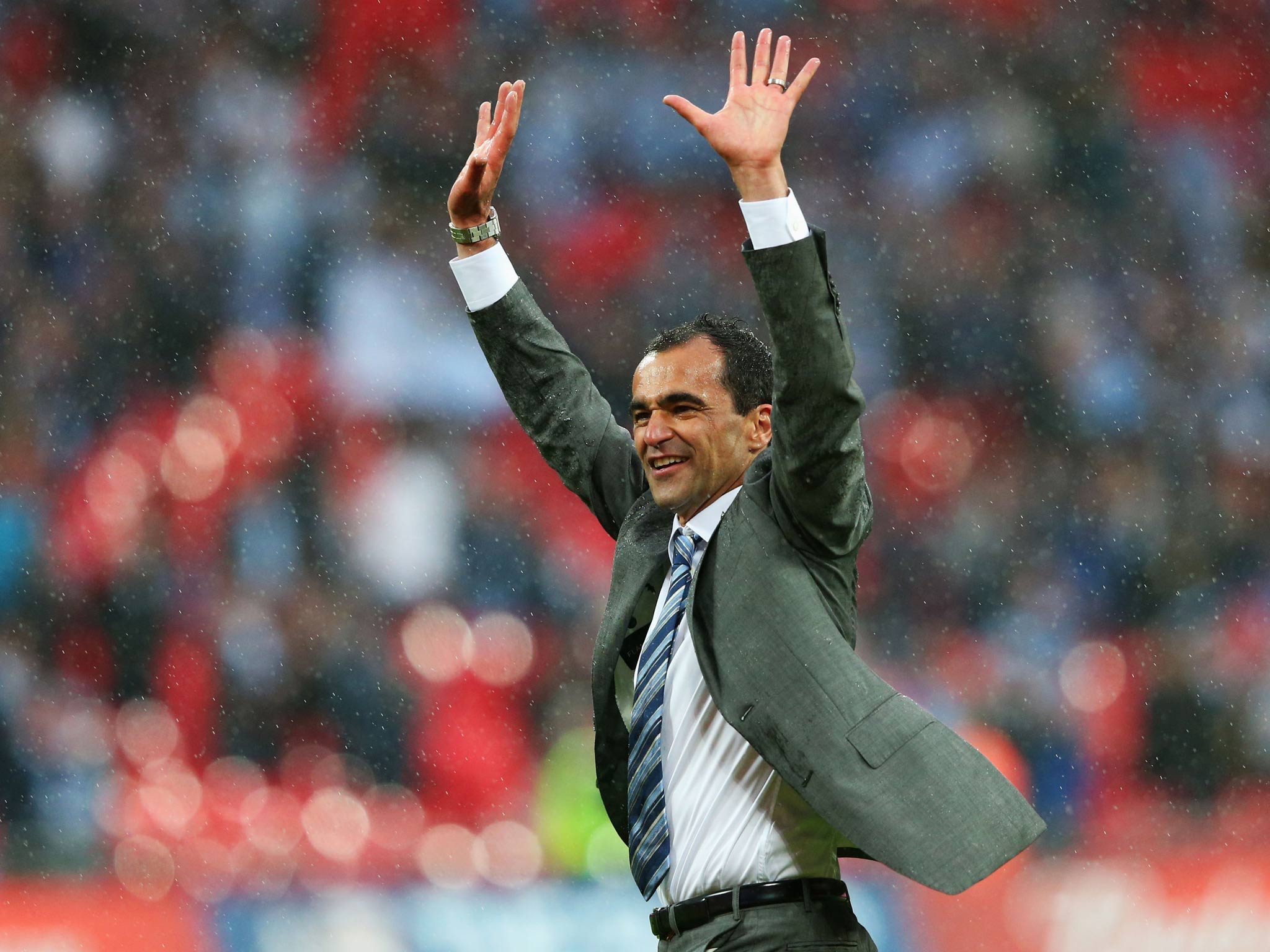 Roberto Martinez celebrates Wigan's famous FA Cup triumph in the pouring rain