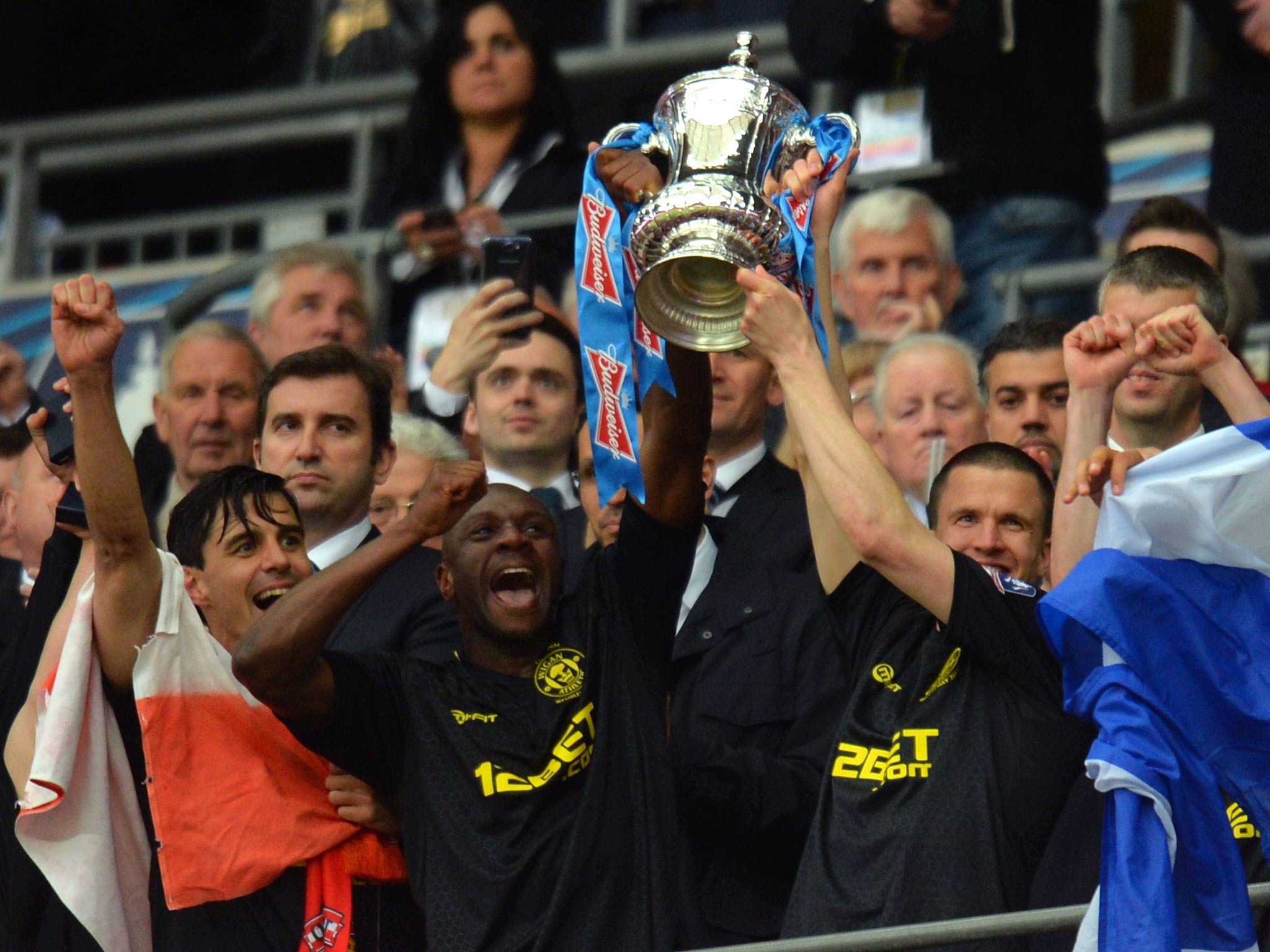 Emerson Boyce and Gary Caldwell lift the FA Cup trophy at Wembley