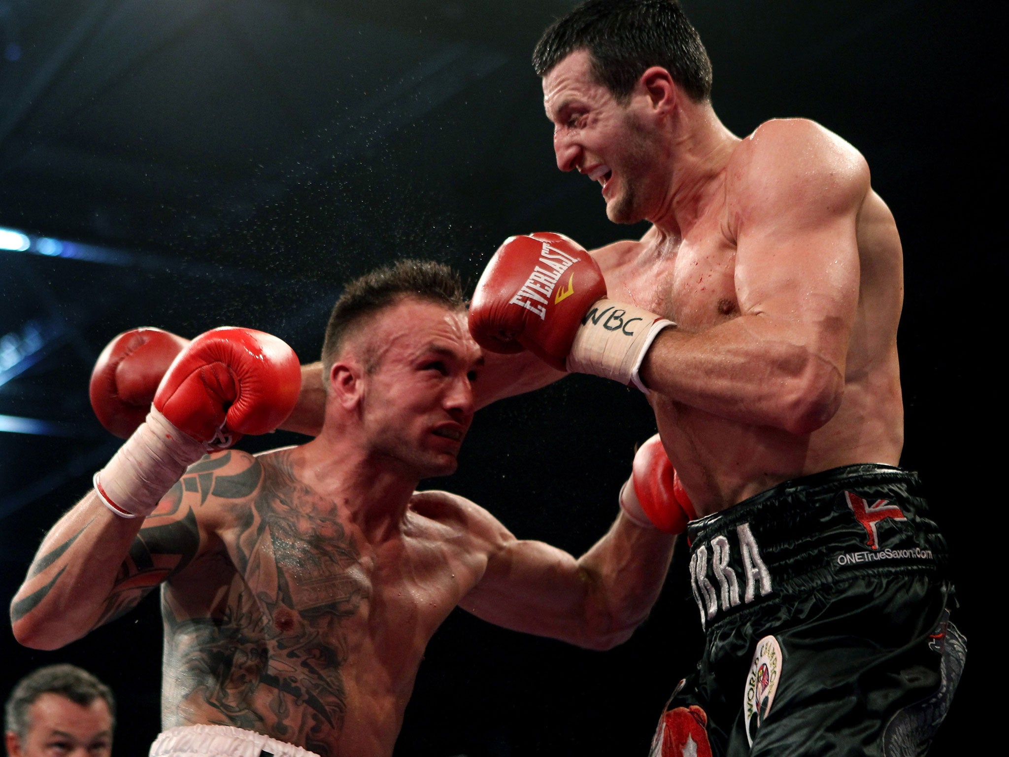 Dane in pain: Mikkel Kessler (left) beat Carl Froch by the narrowest of points decisions in Denmark two years ago