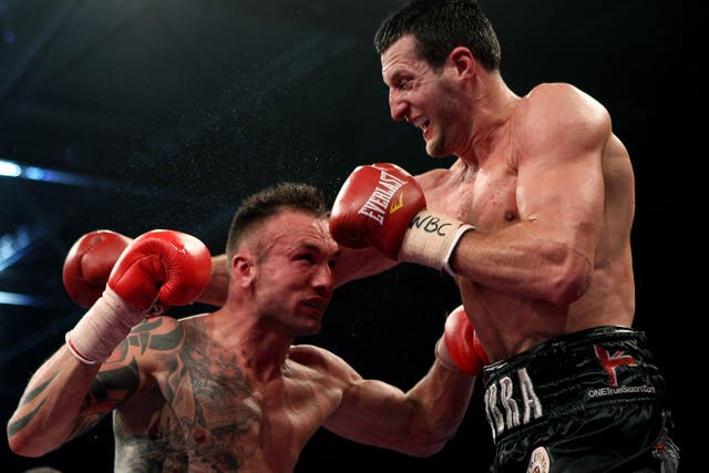 Dane in pain: Mikkel Kessler (left) beat Carl Froch by the narrowest of points decisions in Denmark two years ago