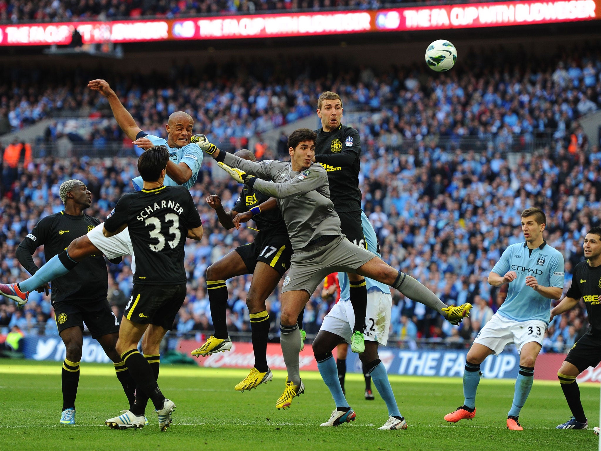 City blues: Captain Vincent Kompany heads an effort on goal, as Mancini’s day ended in disappointment