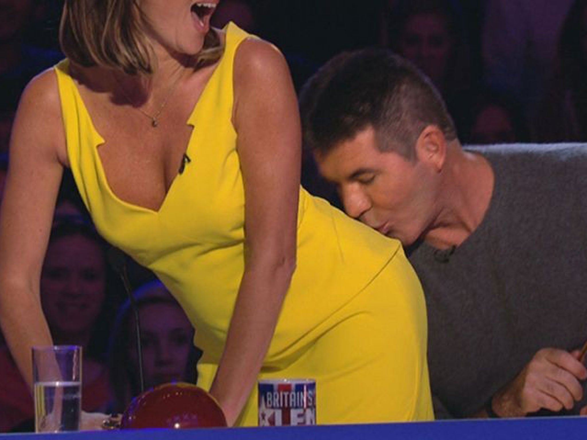 Simon Cowell (right) kissing Amanda Holden during filming of the ITV programme Britain's Got Talent
