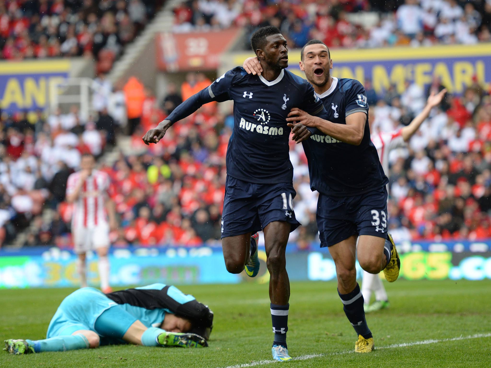 Emmanuel Adebayor celebrates with Steven Caulker after scoring Tottenham's winner in their 2-1 victory over Stoke